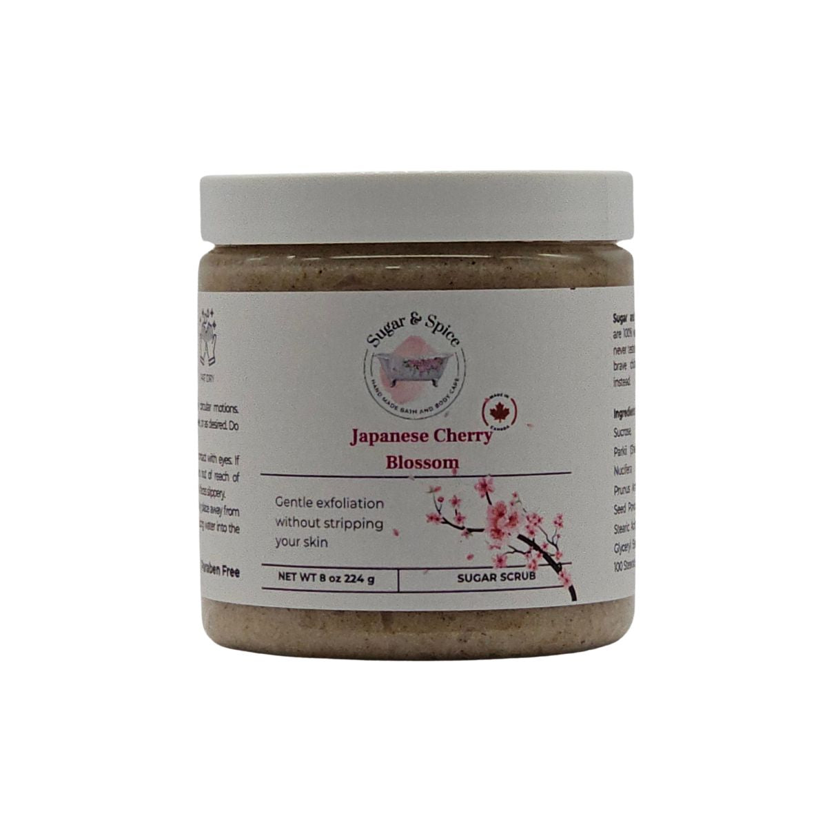 Jar of Japanese Cherry Blossom Sugar Scrub with a white label on a white background