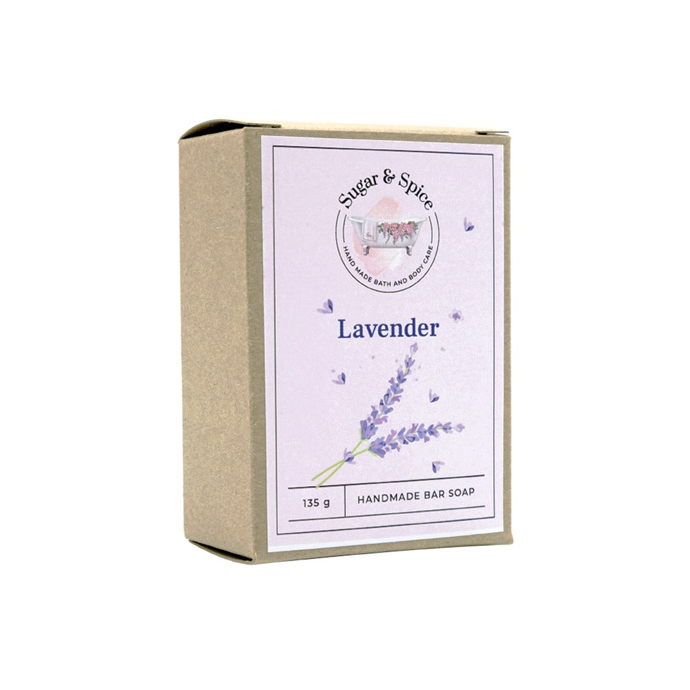 A packaged bar of lavender soap with the brand 'Sugar & Spice' displayed on the box, which is predominantly purple and beige in color with a lavender illustration.