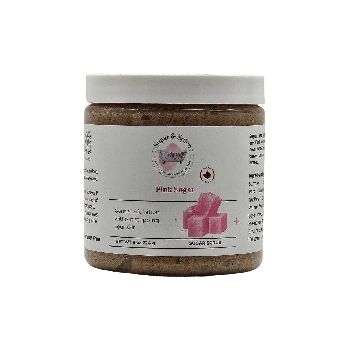 Jar of pink sugar scrub with a white label on a white background