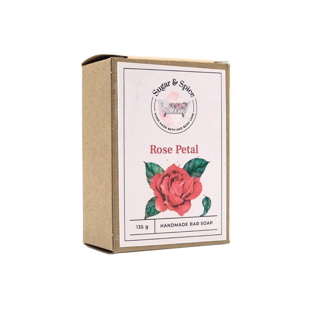 A packaged bar of Rose Petal soap with an image of a rose on the label, indicating it is handmade.