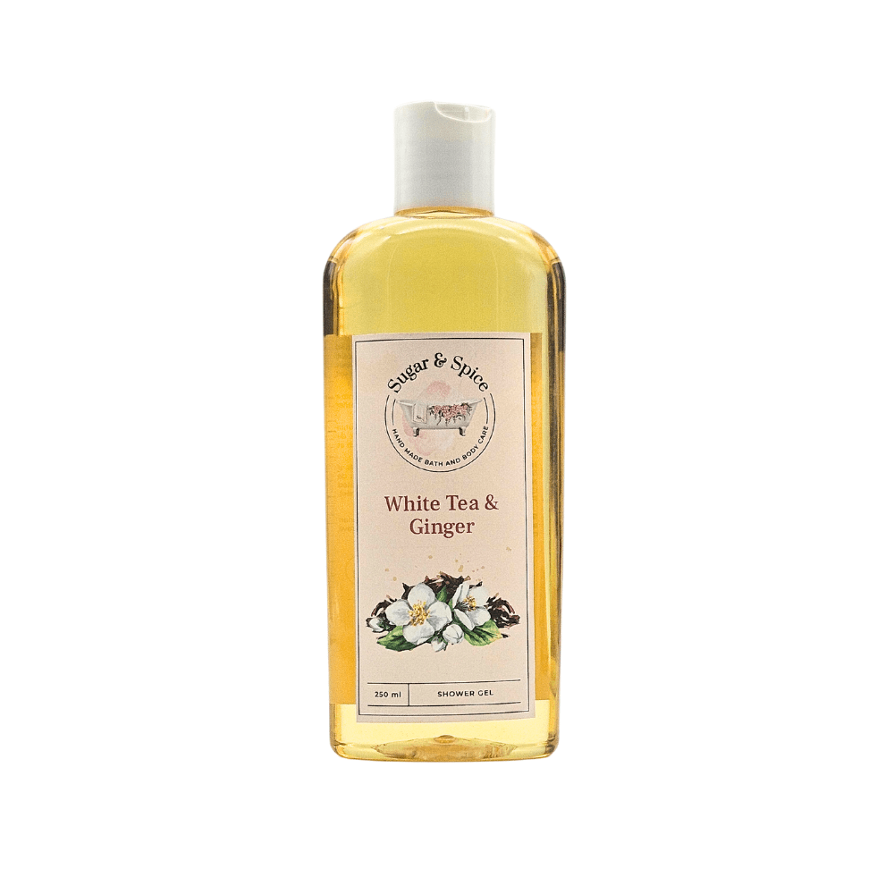 A clear plastic bottle containing yellow liquid labeled as White Tea & Ginger Shower Gel with an image of white tea and ginger on the label.