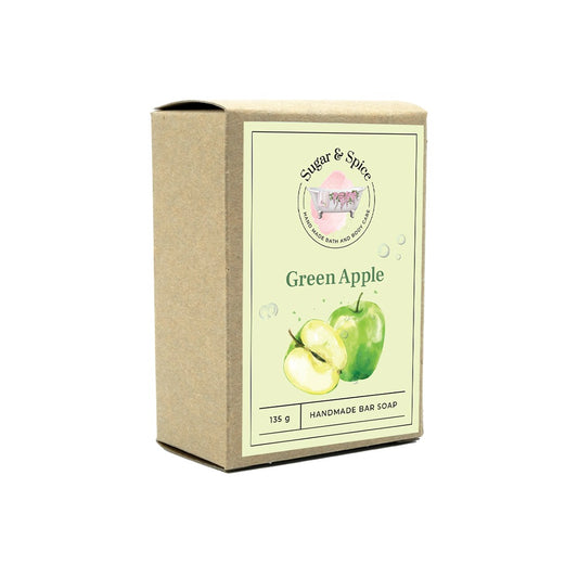 A packaged bar of Green Apple soap with the brand 'Sugar & Spice' displayed on the box, alongside an image of green apples and the text 'Green Apple Handmade Bar Soap'.