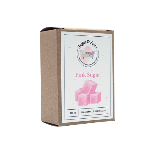 A packaged bar of Pink Sugar soap with the brand name 'Sugar & Spice' displayed on the label. The package is marked as handmade bar soap with a weight of 135g.