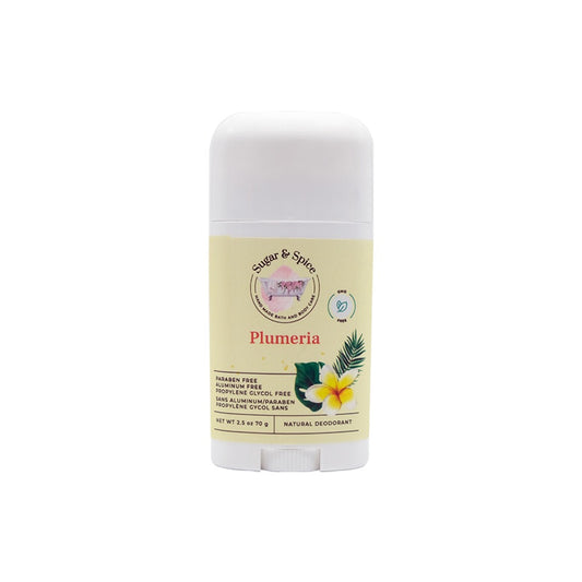 A stick of Plumeria Natural Deodorant with the label showing the product name and an image of plumeria flowers.