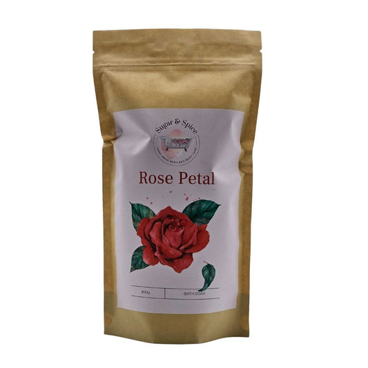 A package of Rose Petal Bath Soak with an illustration of a red rose on the front.