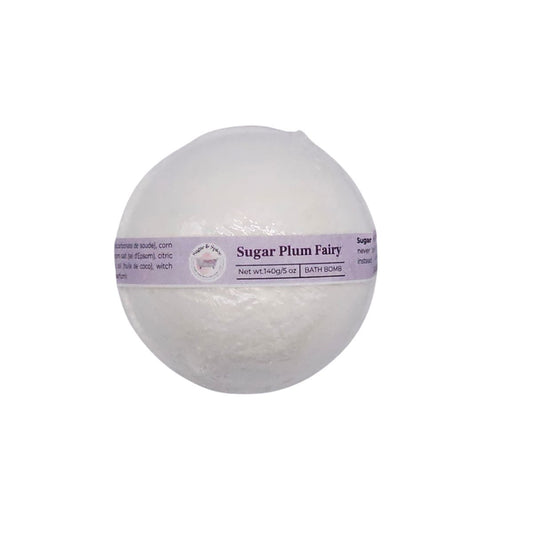 White round Sugar Plum Fairy bath bomb in clear wrapping with a pale purple label.
