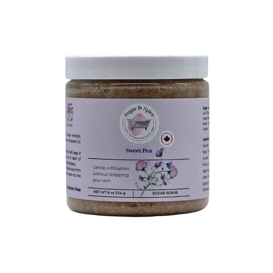 Jar of Sweet Pea Sugar Scrub with a white label on a white background
