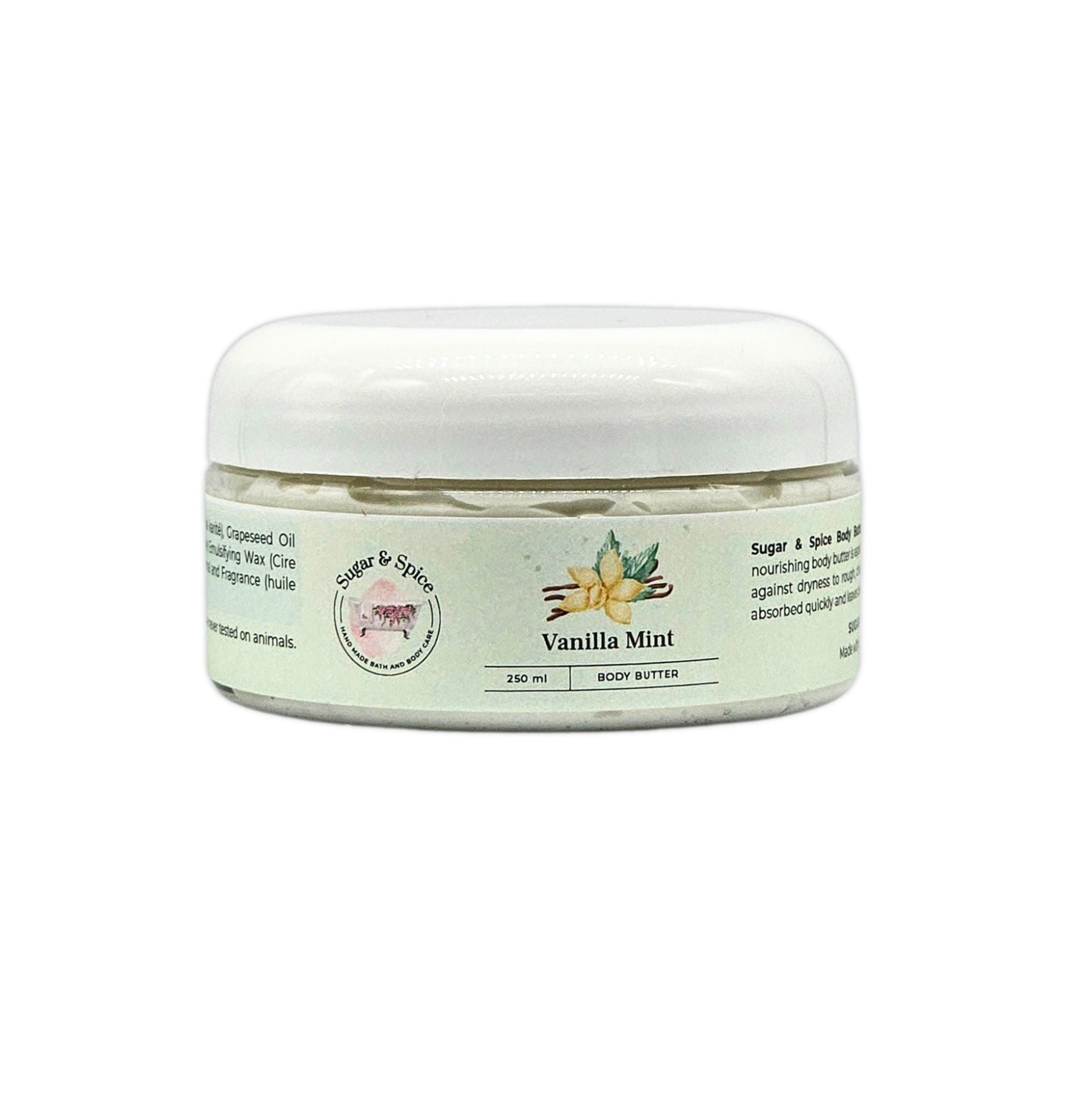 A jar of Vanilla Mint Body Butter with a white lid, labeled with the brand Sugar & Spice Bath & Body, product name, and scent.