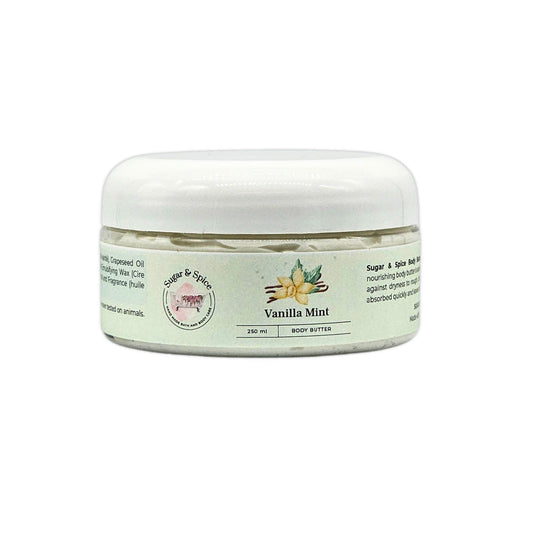 A jar of Vanilla Mint Body Butter with a white lid, labeled with the brand Sugar & Spice Bath & Body, product name, and scent.