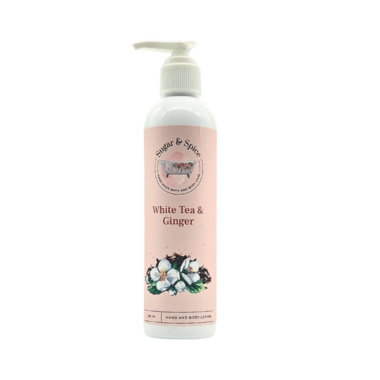 A pump bottle of White Tea & Ginger body lotion with a label featuring white flowers and the text 'Sugar & Spice'.